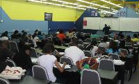 Lecturer (Mr. Imran Hosein) and students at work during study school (MA2)